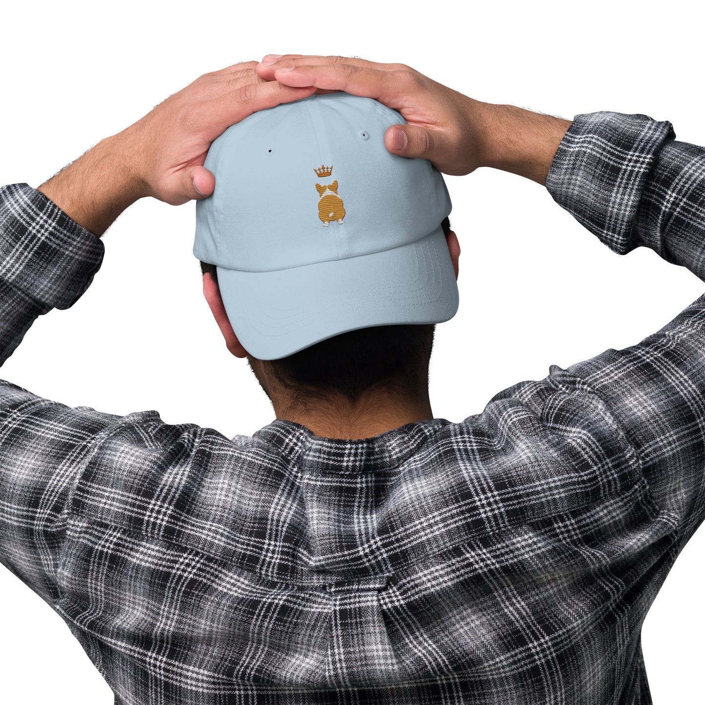 Lifestyle shot of the embroidered Corgi cap, The Loyal Mark