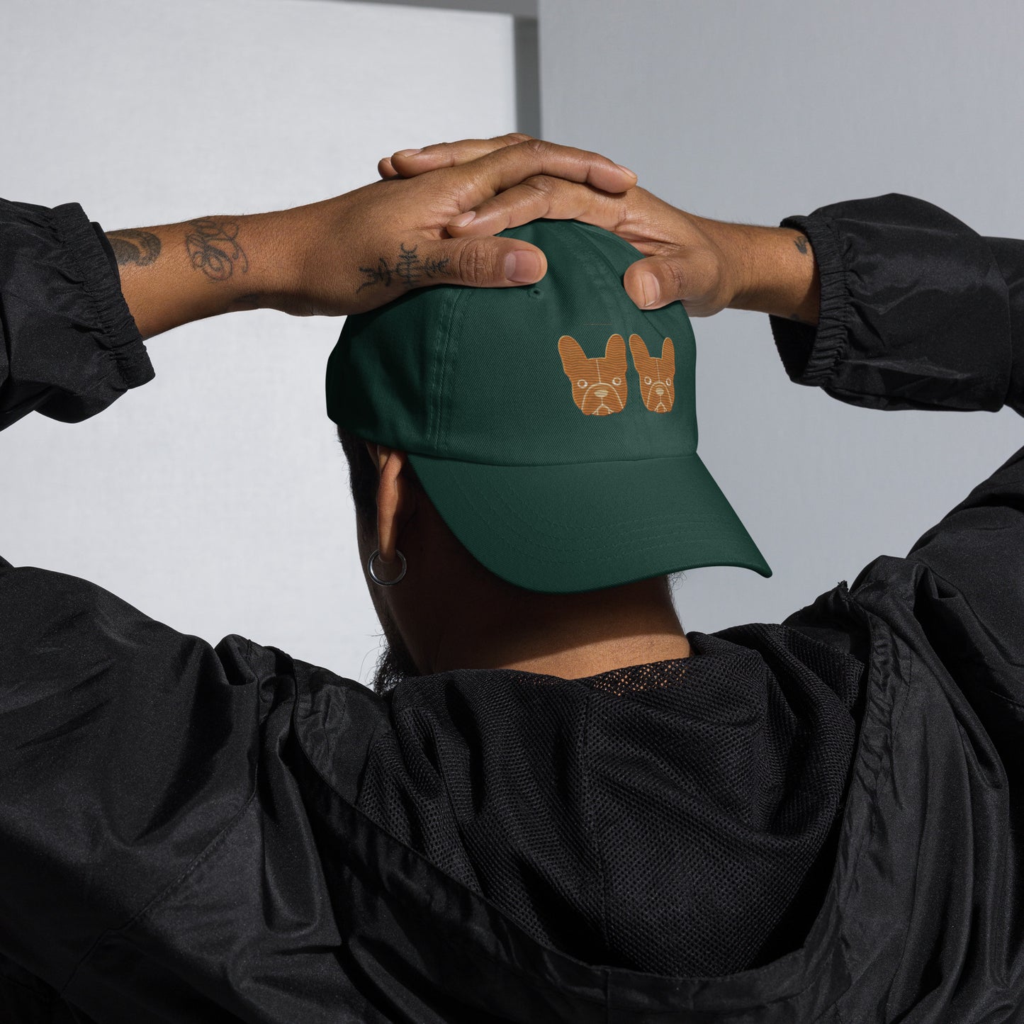 Detail shot of embroidered French Bulldog design on the cap, The Loyal Mark