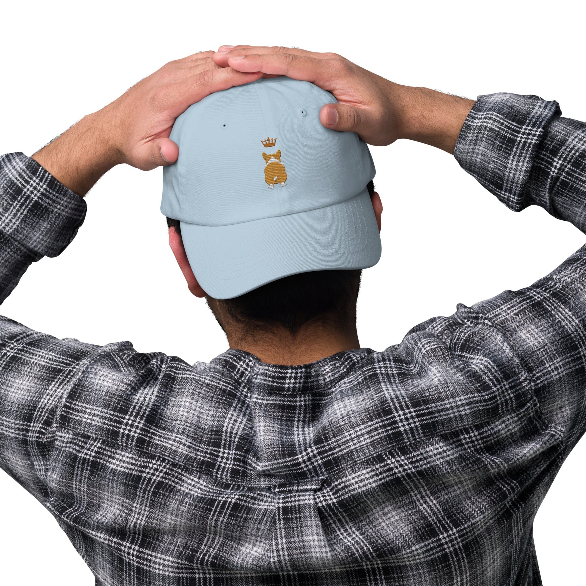 Lifestyle shot of the embroidered Corgi cap, The Loyal Mark