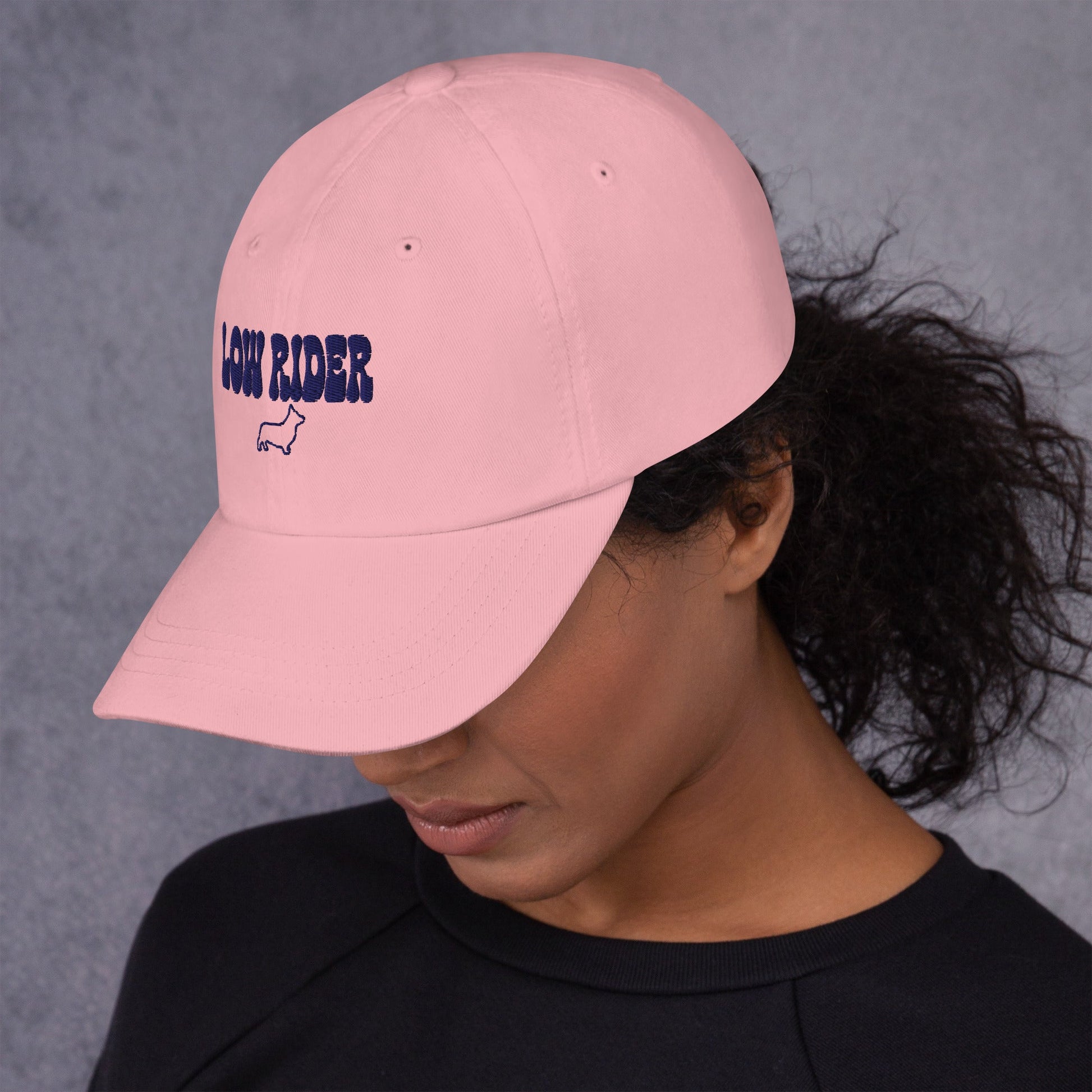 Lifestyle shot of the embroidered Corgi cap, The Loyal Mark