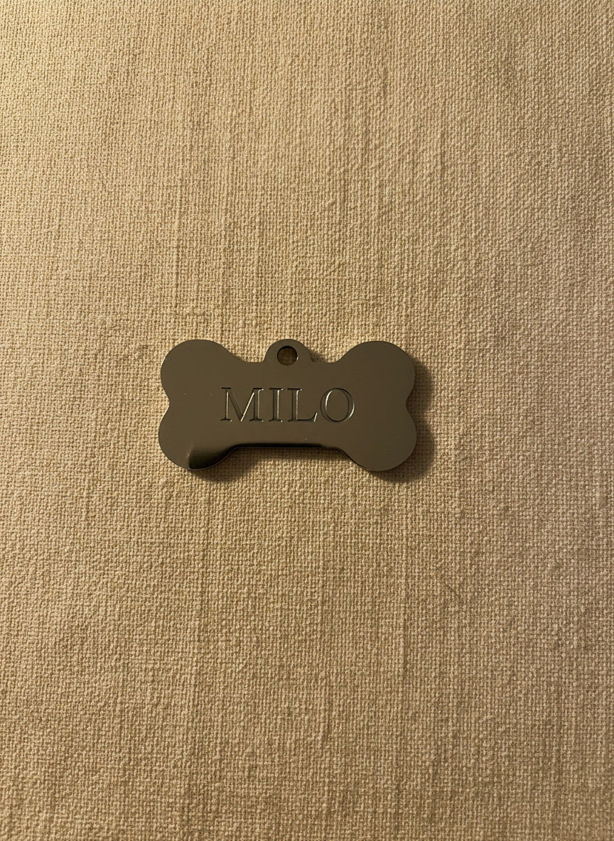 Polished silver stainless steel bone tag with MILO engraving