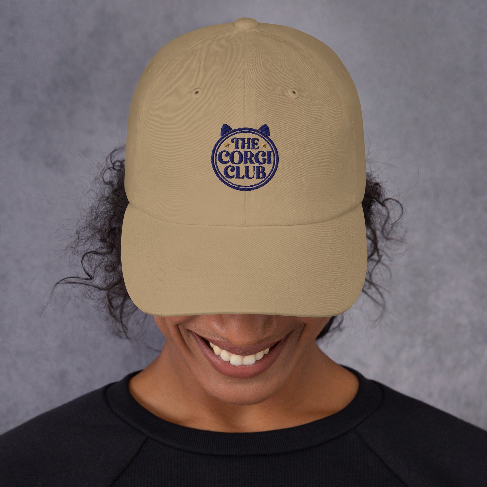 Lifestyle shot of the embroidered Corgi cap, The Loyal Mark