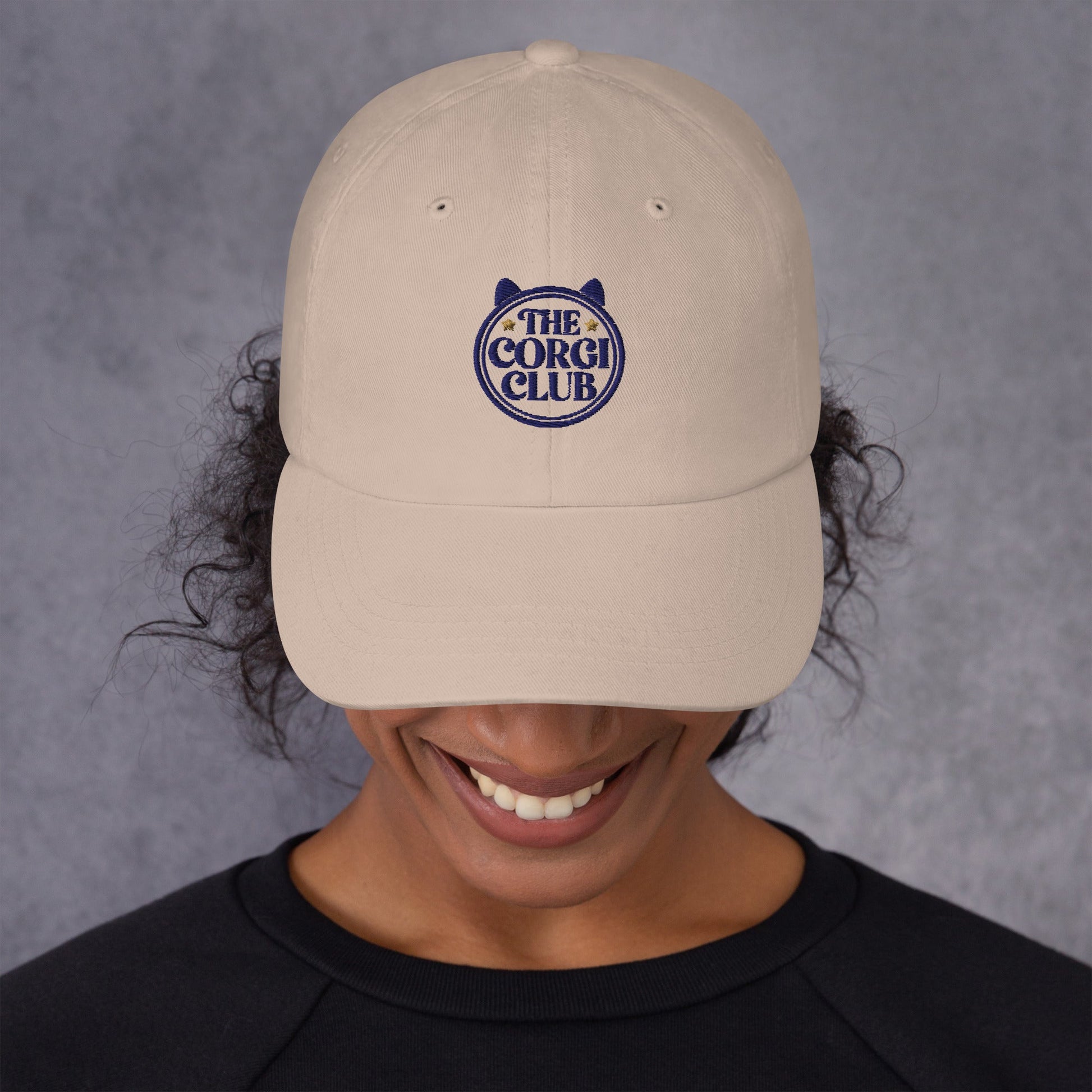 Lifestyle shot of the embroidered Corgi cap, The Loyal Mark