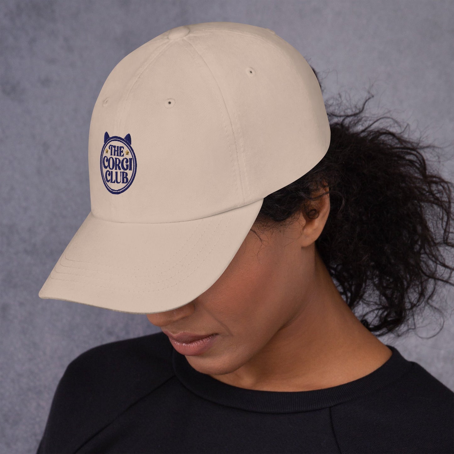 Lifestyle shot of the embroidered Corgi cap, The Loyal Mark