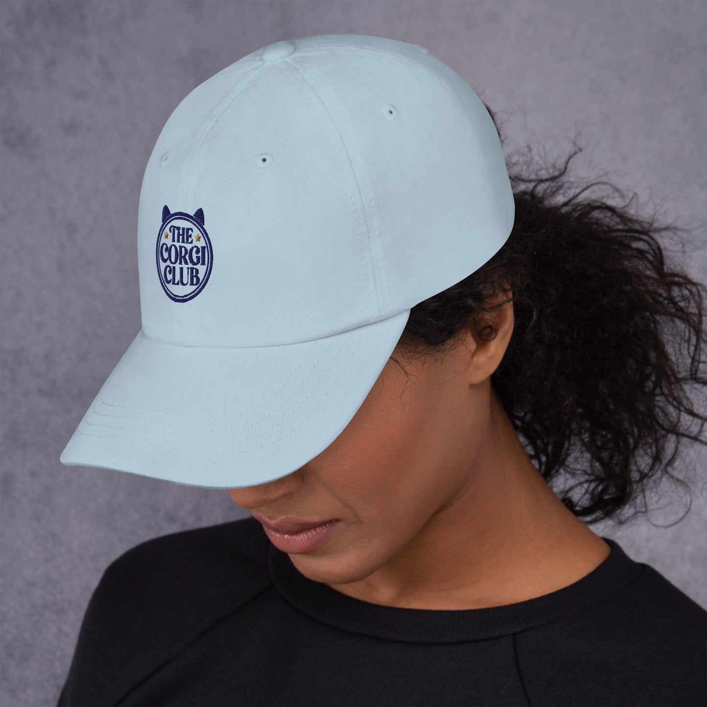 Lifestyle shot of the embroidered Corgi cap, The Loyal Mark