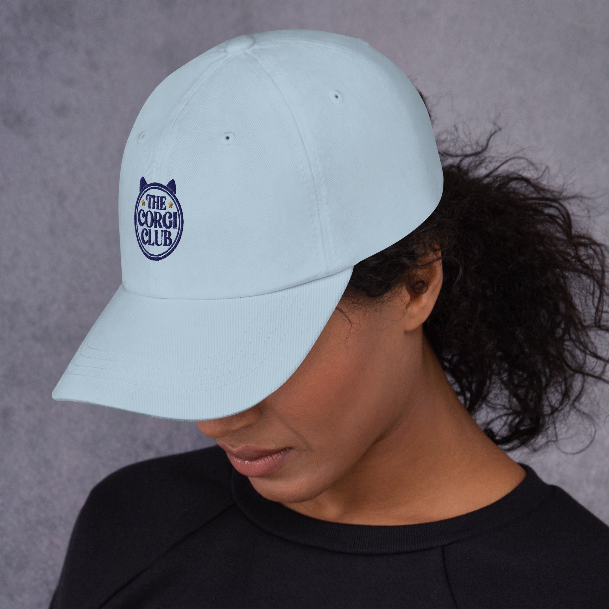 Lifestyle shot of the embroidered Corgi cap, The Loyal Mark