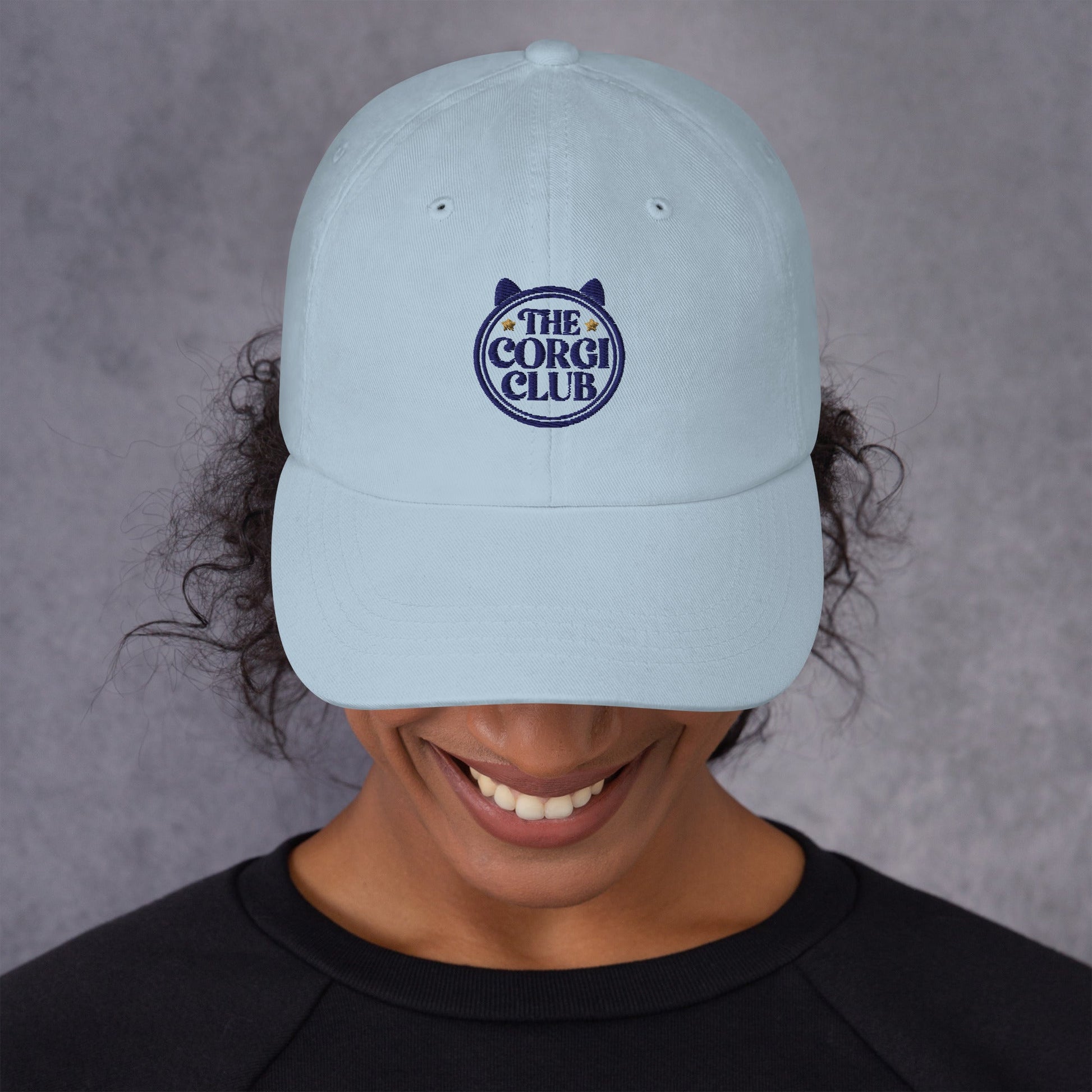 Lifestyle shot of the embroidered Corgi cap, The Loyal Mark