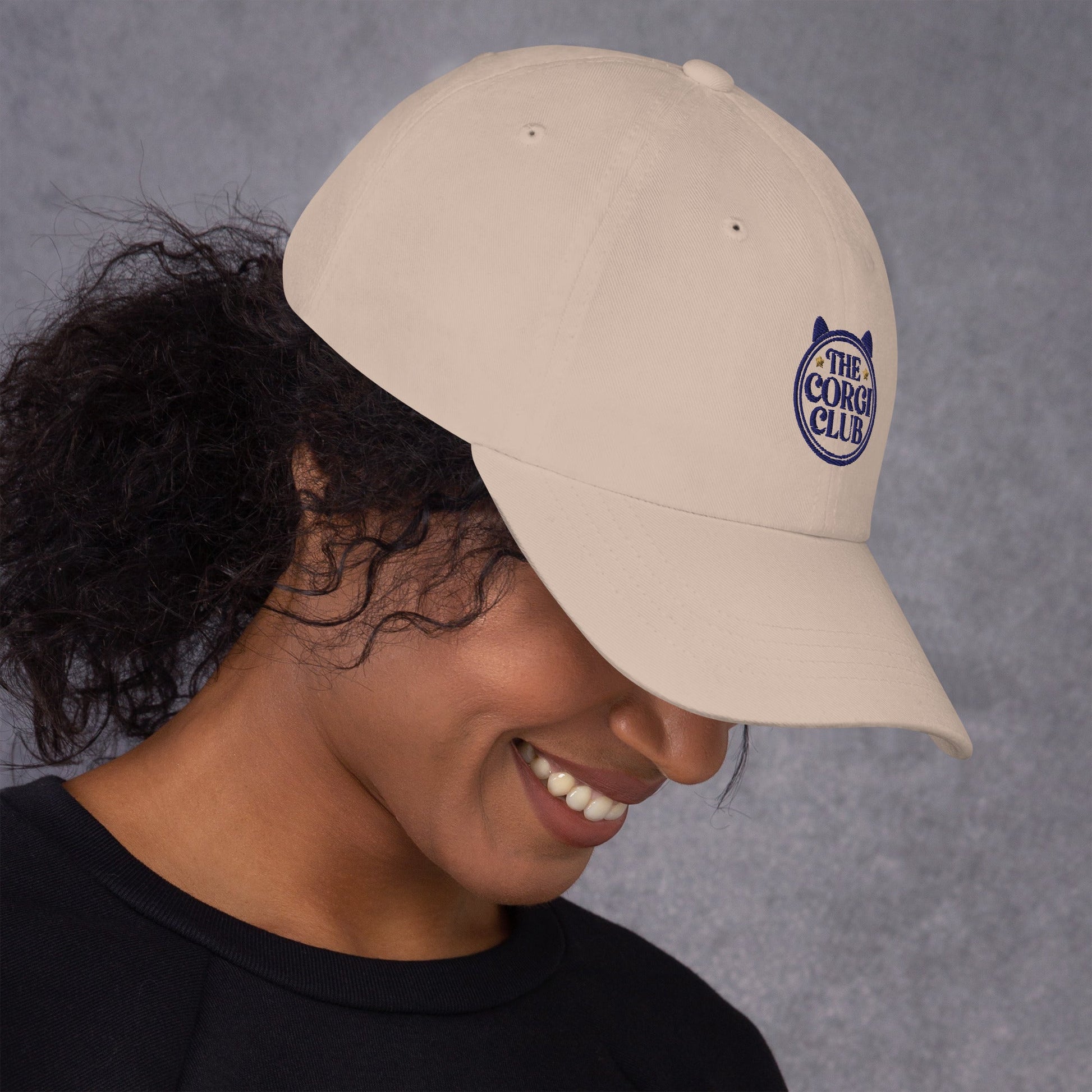 Lifestyle shot of the embroidered Corgi cap, The Loyal Mark